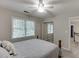 Bright bedroom with a ceiling fan, double window, and closet with mirrored sliding doors at 2903 Brookshire Way, Duluth, GA 30096