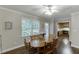 Bright dining room features hardwood floors, a large window, and seamless access to the kitchen at 2903 Brookshire Way, Duluth, GA 30096