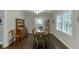 Elegant dining room is furnished with hardwood floors, a chandelier, and a wooden dining set at 2903 Brookshire Way, Duluth, GA 30096
