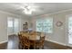 Bright dining room includes hardwood floors, a chandelier, and direct access to the backyard at 2903 Brookshire Way, Duluth, GA 30096