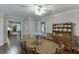 Cozy dining room with hardwood floors showcases a wooden hutch and seamless access to other rooms at 2903 Brookshire Way, Duluth, GA 30096