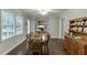 Sunlit dining area displays hardwood floors, direct access to the kitchen, and a charming wooden hutch at 2903 Brookshire Way, Duluth, GA 30096