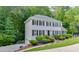 Beautiful two-story home featuring lush landscaping, a manicured lawn, and an attached garage at 2903 Brookshire Way, Duluth, GA 30096