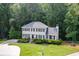 Charming two-story traditional home with a well-manicured lawn and mature trees at 2903 Brookshire Way, Duluth, GA 30096