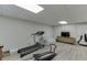 Home gym features treadmill, Total Gym, TV, and comfortable seating at 2903 Brookshire Way, Duluth, GA 30096