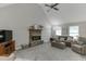 Spacious living room with vaulted ceilings, a stone fireplace, and comfortable seating at 2903 Brookshire Way, Duluth, GA 30096