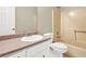 Standard bathroom featuring white vanity, toilet, and peach-colored shower-tub at 326 Acaro Ct, Ellenwood, GA 30294