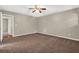Bedroom with neutral walls, plush carpeting, ceiling fan, and access to a closet space at 326 Acaro Ct, Ellenwood, GA 30294