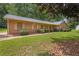 Spacious home featuring a well-manicured lawn, attractive landscaping, and a side entry garage at 326 Acaro Ct, Ellenwood, GA 30294