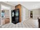 Open kitchen featuring tile floors and convenient access to additional rooms at 326 Acaro Ct, Ellenwood, GA 30294