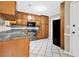 Functional kitchen with granite countertops, stainless steel appliances, and tile flooring at 326 Acaro Ct, Ellenwood, GA 30294