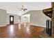 Spacious living room featuring hardwood floors and a cozy brick fireplace at 326 Acaro Ct, Ellenwood, GA 30294