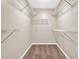 Walk-in closet features wire shelving and carpet flooring, offering ample storage space at 326 Acaro Ct, Ellenwood, GA 30294