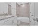 Bathroom with granite countertop vanity, white cabinetry, and modern fixtures at 1114 Low Water Crossing Nw, Acworth, GA 30101