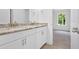 Bathroom vanity with double sinks, granite countertop and a window at 1114 Low Water Crossing Nw, Acworth, GA 30101