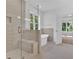 Bathroom featuring a glass shower, seat, and neutral-toned tile at 1114 Low Water Crossing Nw, Acworth, GA 30101