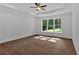 Bright bedroom featuring hardwood floors, a large window, and recessed lighting at 1114 Low Water Crossing Nw, Acworth, GA 30101