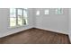 Bright bedroom featuring large windows and beautiful wood-look flooring, ready for personalization at 1114 Low Water Crossing Nw, Acworth, GA 30101
