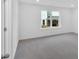 Bedroom with carpeting and a window letting in natural light at 1114 Low Water Crossing Nw, Acworth, GA 30101