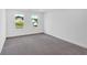 Clean bedroom with carpeted floors and a window letting in natural light at 1114 Low Water Crossing Nw, Acworth, GA 30101