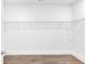 Walk-in closet with wire shelving and wood-look floors at 1114 Low Water Crossing Nw, Acworth, GA 30101