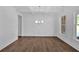 Dining room featuring hardwood floors, crown molding, and a modern chandelier at 1114 Low Water Crossing Nw, Acworth, GA 30101