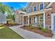 Charming home featuring brick, stone accents, manicured landscaping and a sidewalk leading to a covered front porch at 1114 Low Water Crossing Nw, Acworth, GA 30101