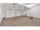 Spacious two car garage with white doors and concrete floors at 1114 Low Water Crossing Nw, Acworth, GA 30101