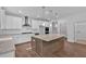 Beautiful kitchen with a large island, stainless steel appliances, and white cabinets with granite countertops at 1114 Low Water Crossing Nw, Acworth, GA 30101