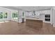Spacious kitchen with an island, stainless steel appliances, and seamless transition to living area for easy entertaining at 1114 Low Water Crossing Nw, Acworth, GA 30101