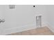 This laundry room features tile flooring and white trim at 1114 Low Water Crossing Nw, Acworth, GA 30101