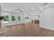 Open-concept living room with views of the kitchen, hardwood flooring, and plenty of natural light at 1114 Low Water Crossing Nw, Acworth, GA 30101