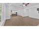 Open-concept living room with a kitchen view, recessed lighting, and hardwood floors, ideal for entertaining at 1114 Low Water Crossing Nw, Acworth, GA 30101