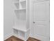 Mudroom with cubbies, hooks, and a bench, next to a door at 1114 Low Water Crossing Nw, Acworth, GA 30101