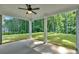 Covered patio featuring white columns and a ceiling fan, providing a comfortable outdoor space overlooking the backyard at 1114 Low Water Crossing Nw, Acworth, GA 30101