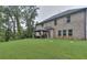 Spacious backyard with lush lawn, shade trees, and covered gazebo at 116 Chorley Run, Ellenwood, GA 30294