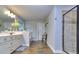 Stylish bathroom with double vanity, wood floors, a soaking tub, and a separate tile and glass shower at 116 Chorley Run, Ellenwood, GA 30294