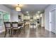 Dining room showcasing wood floors and open access to kitchen at 116 Chorley Run, Ellenwood, GA 30294