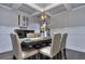 Dining room with table, chairs, wainscoting, and hardwood floors at 116 Chorley Run, Ellenwood, GA 30294