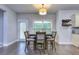 Dining room with wood floors, recessed lights, and a window providing natural light at 116 Chorley Run, Ellenwood, GA 30294