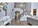 Inviting foyer features hardwood floors and staircase with iron railings at 116 Chorley Run, Ellenwood, GA 30294