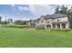 Expansive front yard and landscaped lawn, with traditional two-story home in background at 116 Chorley Run, Ellenwood, GA 30294