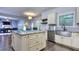 Kitchen with a large island, stainless steel appliances, granite countertops, and access to the living room at 116 Chorley Run, Ellenwood, GA 30294