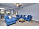 Living room with comfortable seating and view into the kitchen at 116 Chorley Run, Ellenwood, GA 30294