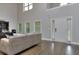 Bright living room with lots of natural light and wood floors at 116 Chorley Run, Ellenwood, GA 30294