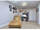 Office area featuring a plush chair, desk, and decorative wall art at 116 Chorley Run, Ellenwood, GA 30294