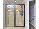 Contemporary tile shower with glass doors, offering a spa-like experience and modern fixtures at 116 Chorley Run, Ellenwood, GA 30294
