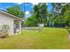 Spacious backyard with lush lawn, shed, fire pit area, patio, and privacy fence at 1442 Pierce Se Ave, Smyrna, GA 30080