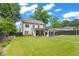 Large backyard featuring a patio with an outdoor kitchen and an expansive lawn at 1442 Pierce Se Ave, Smyrna, GA 30080