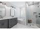Elegant bathroom features a double vanity, soaking tub, and walk-in shower with modern fixtures and marble accents at 1442 Pierce Se Ave, Smyrna, GA 30080